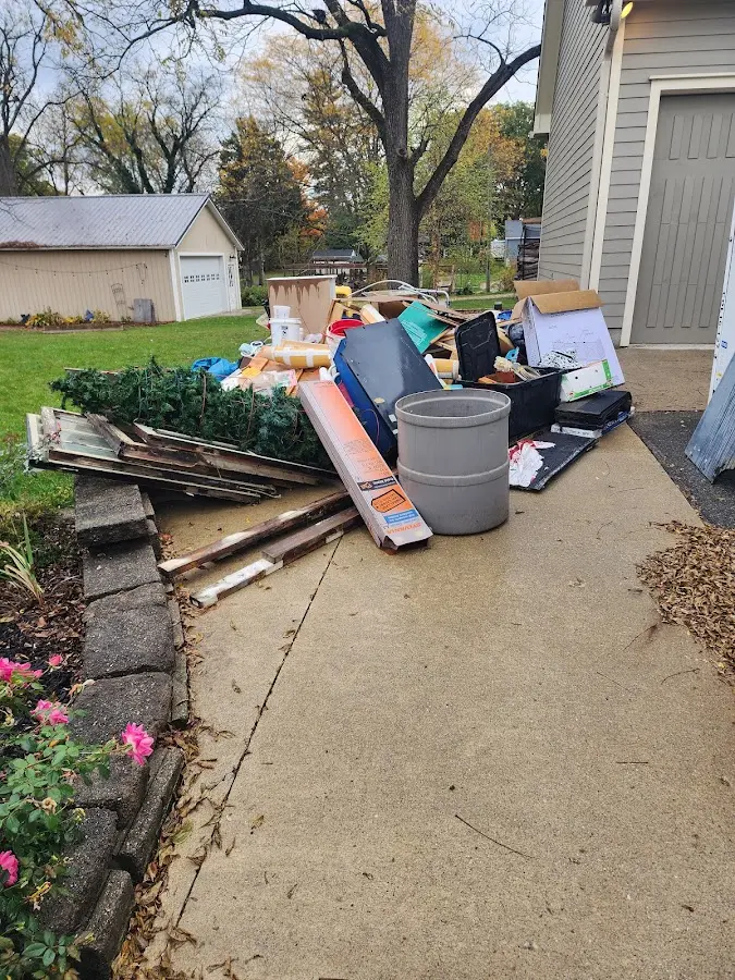 Dumpster being loaded with debris for Residential Dumpster Rental in Sherman